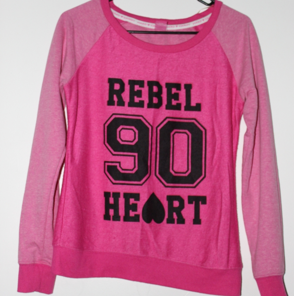 A rebel at heart! Pink crew neck sweater.